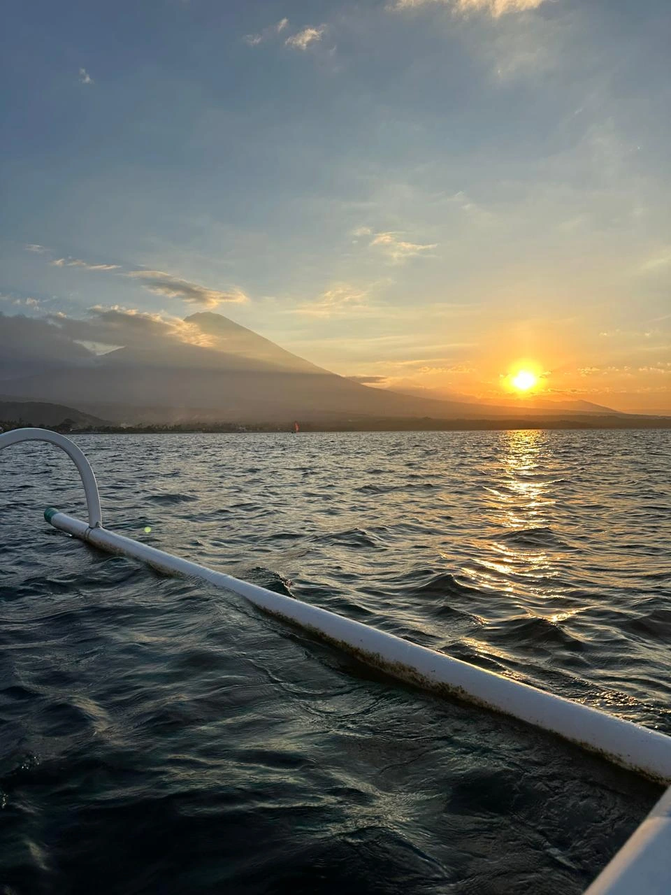 Sunrise over the sea seen from a traditional jukung boat in Amed